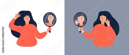 Smiling woman looks at the mirror
