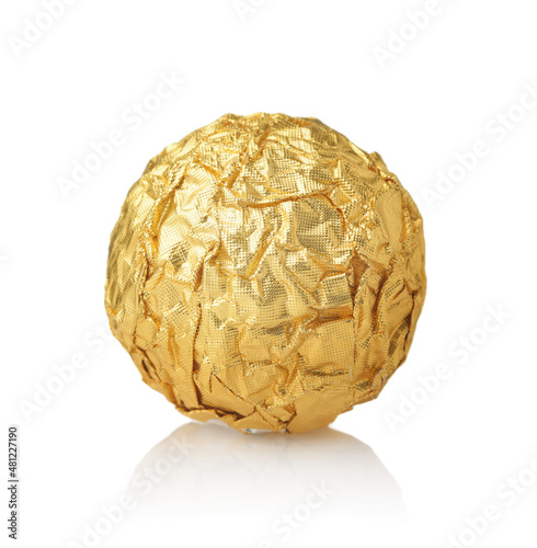 Single chocolate ball candy in gold foil wrapper