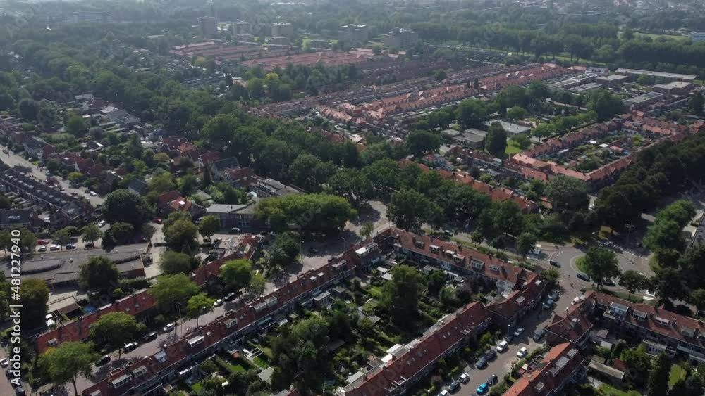 Aerial top view of a city in Holland, surrounded by houses, green trees and canal Aerial top view of a city in Holland, surrounded by houses, green trees and canal