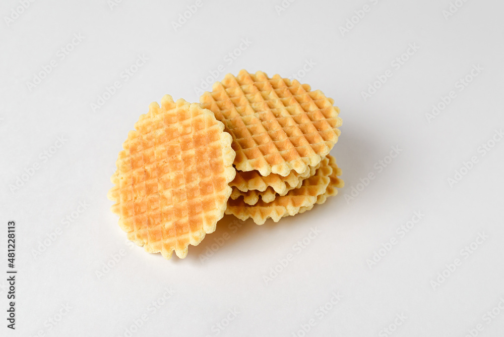 Crunchy cookies, waffles or snacks on a solid white background. Copy space, isolate Crunchy cookies, waffles or snacks on a solid white background. Copy space, isolate