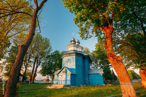 Staraya Belitsa, Uritskiy Sel'sovet , Gomel Region, Belarus. Old Wooden Orthodox Church Of St Nicholas The Wonderworker During Summer Sunset. Orthodox Church Of St. Nikolaya Chudotvortsa photo