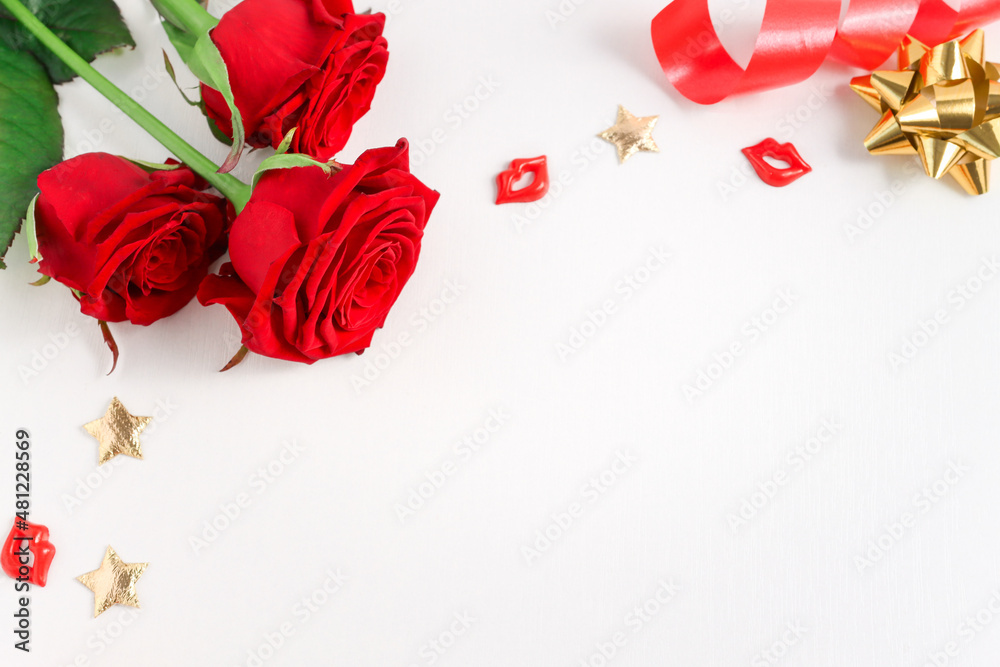 Festive background with a bouquet of red roses, gifts and gold confetti ...