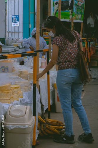 cheeses in the market. person shopping in the market price, buy and sell popular market. Cuzco market. Latin markets. sale of vegetables, meat and milk. farmers market. Peru.