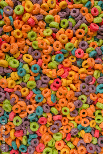 Sweet multicolored flakes, cereal loops. © Nikolay