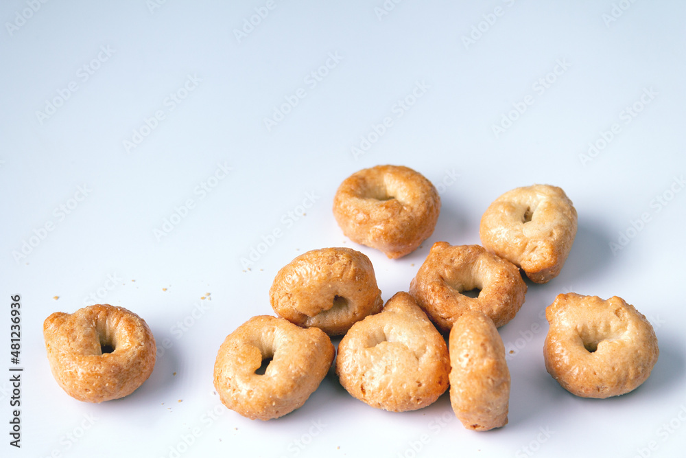salty round cookies on a white background, space for text, close-up