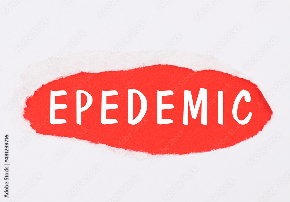 The word epedemic is standing on a red colored torn paper, end of covid-19 pandemic, back to normal, post lockdown The word epedemic is standing on a red colored torn paper, end of covid-19 pandemic, back to normal, post lockdown