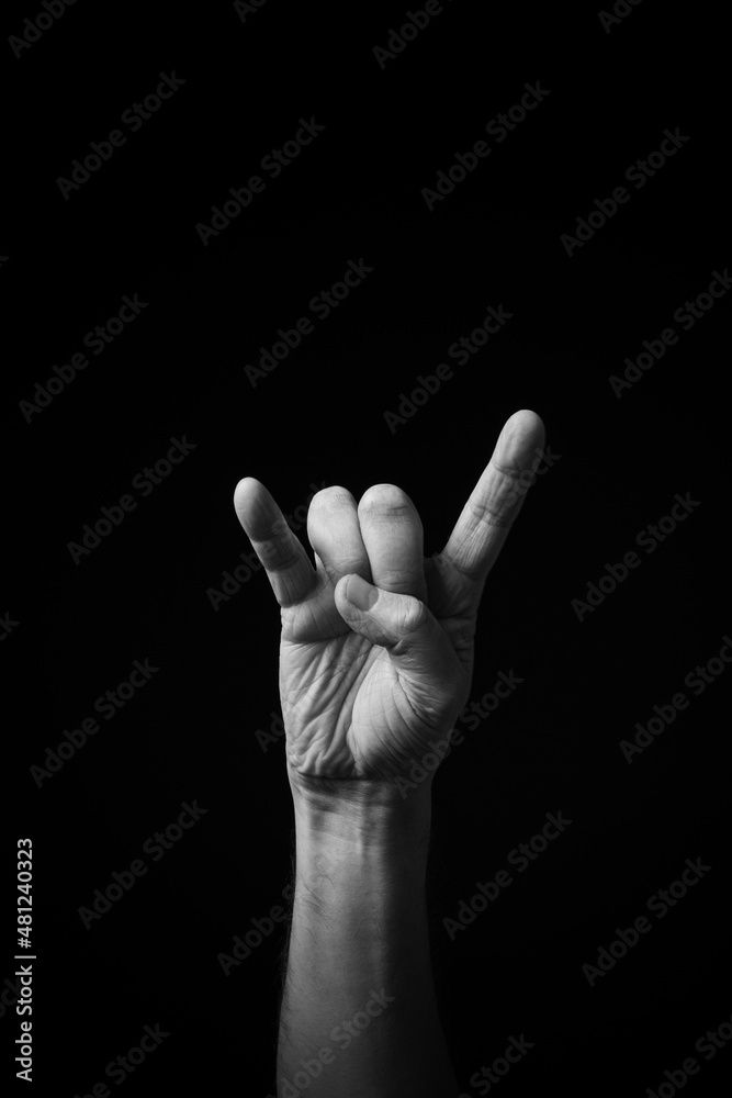 B+W image of hand demonstrating Chinese sign language letter T isolated against black background B+W image of hand demonstrating Chinese sign language letter T isolated against black background