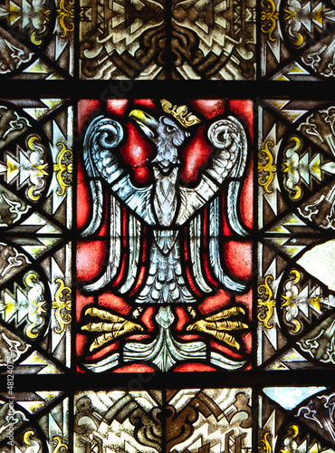 Gniezno, Poland - Polish ancient national emblem, white eagle on red background. Stained glass in the coronational cathedral.