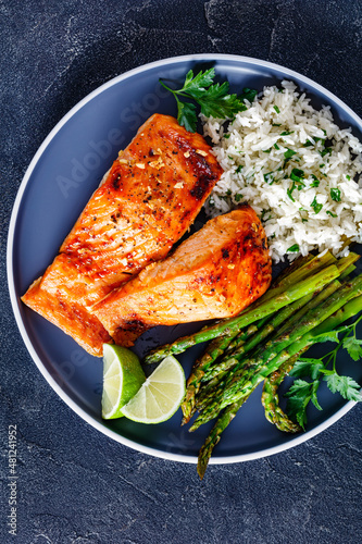 fried salmon fish fillet with rice and asparagus