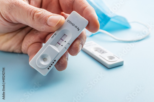 Positive Covid-19 antigen test in hand. Coronavirus antigen rapid test.