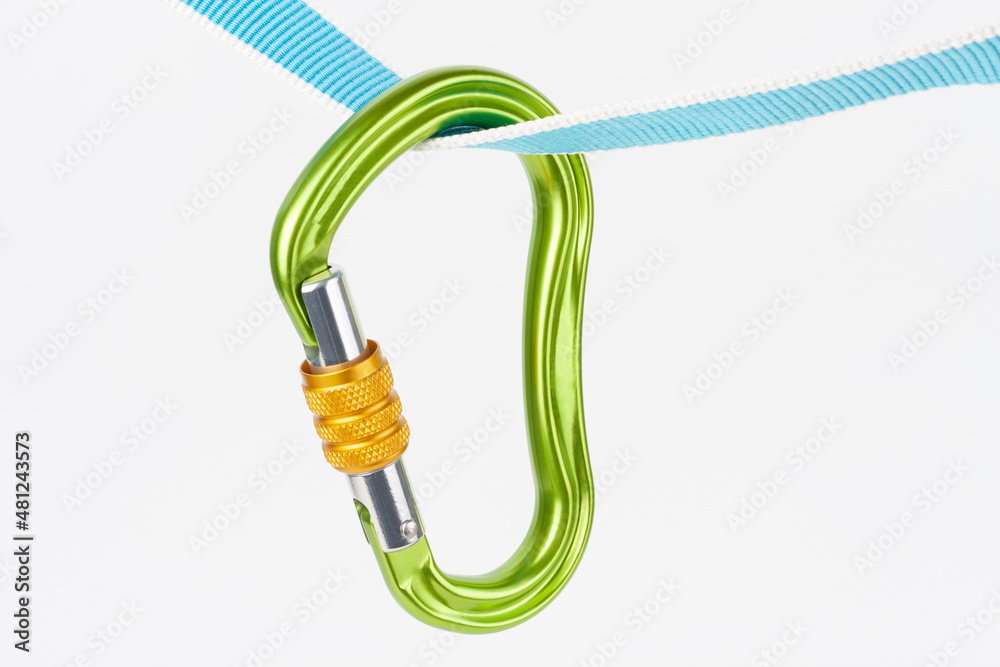 New green HMS carabiner, screw lock snap hook, climbing equipment on sewn loop sling on white background New green HMS carabiner, screw lock snap hook, climbing equipment on sewn loop sling on white background