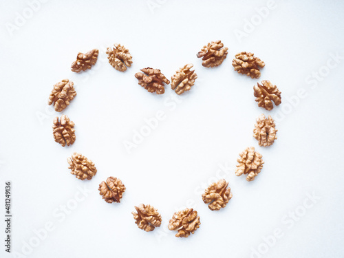 Heart on a white background laid out from walnuts