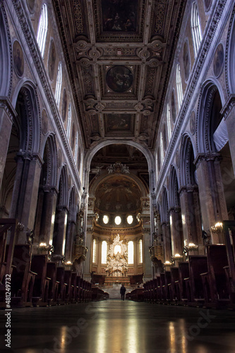 interior of a basilica, shot from low angle and a person is walking in distance © Alican