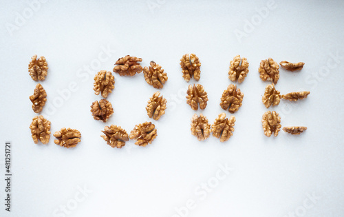 word love laid out from walnuts on a white background