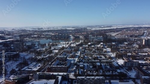 Winter aerial view of a snow covered residential Holland