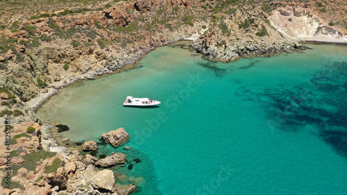 Aerial drone photo of inflatable rib boat anchored in beautiful beach of Kalogria with emerald crystal clear sea, Milos island, Cyclades, Greece