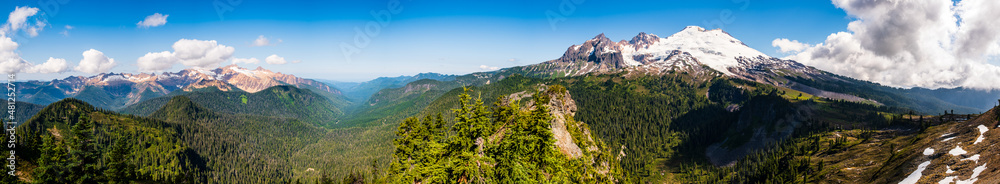 A panoramic view of Mt. Baker and its surroundings as seen from a hiking trail