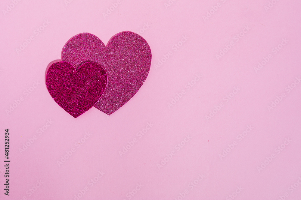 Heart shapes with glitter in different colors on a purple background in combination with ring box, chocolate or red rose. Nice and simple Valentine's day or engagement concept, Heart shapes with glitter in different colors on a purple background in combination with ring box, chocolate or red rose. Nice and simple Valentine's day or engagement concept,
