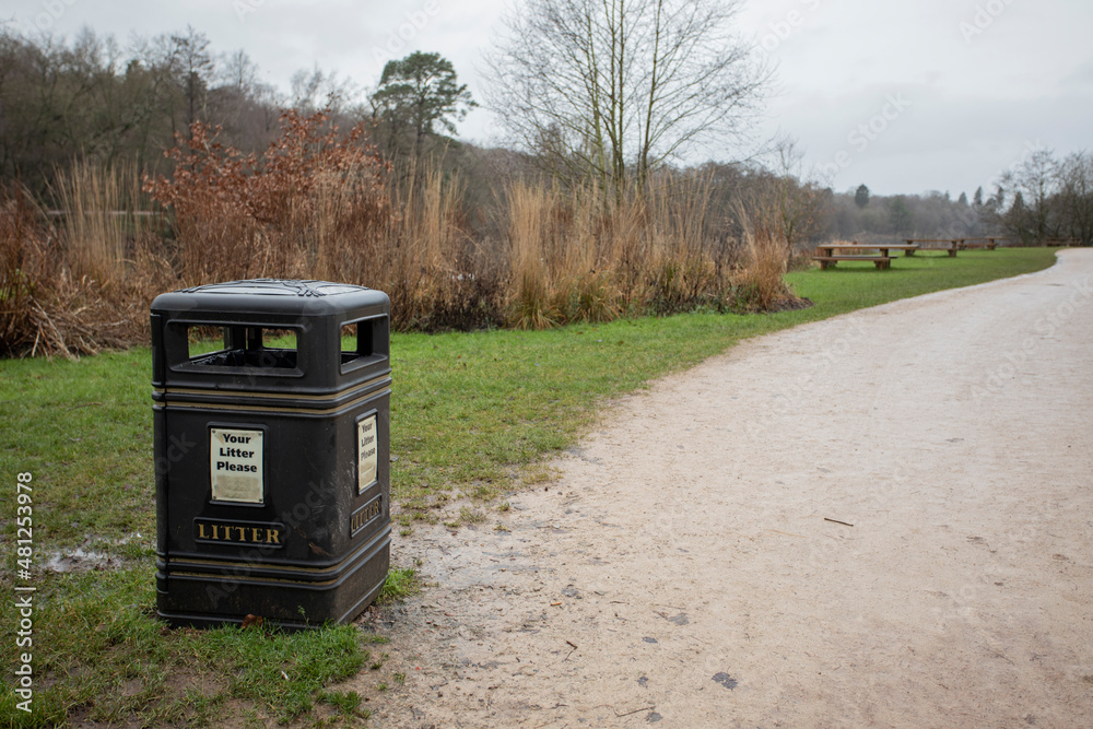 black litter bin by the side of a path in a local beauty spot black litter bin by the side of a path in a local beauty spot