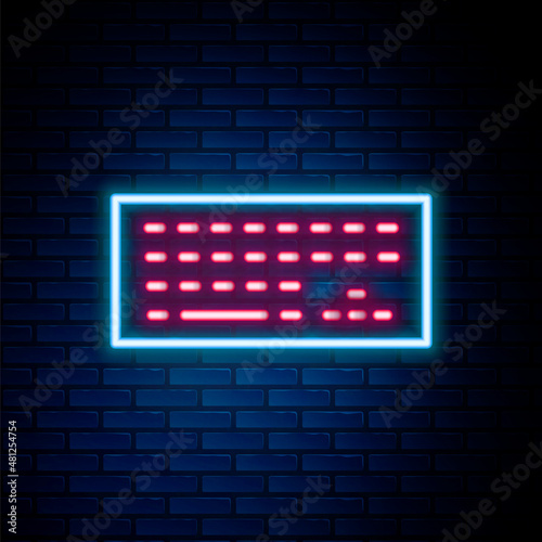Glowing neon line Computer keyboard icon isolated on brick wall background. PC component sign. Colorful outline concept. Vector