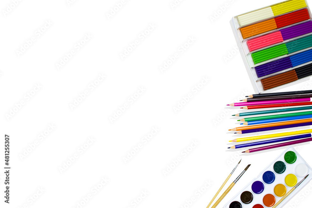 Stationery, namely colored pencils, paints, plasticine and brushes on a white isolated background with copy space Stationery, namely colored pencils, paints, plasticine and brushes on a white isolated background with copy space