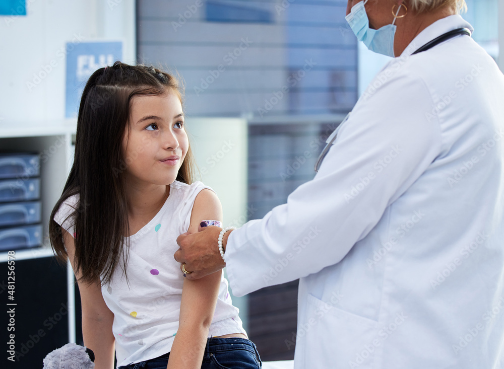 Fototapeta premium That wasn't so bad. Shot of a little girl getting a vaccination by a doctor in a hospital.