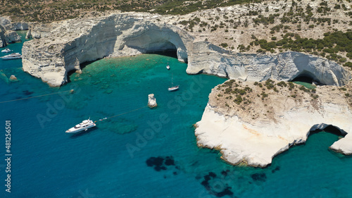 Aerial drone photo of Kleftiko a beautiful scenic white volcanic rock formation bay visited by sail boats and yachts with turquoise crystal clear sea and caves, Sea Meteora of Greece, Milos island