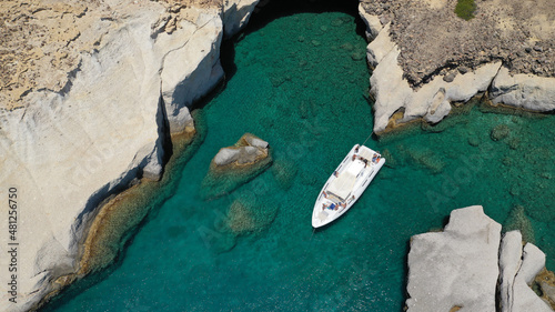 Aerial drone photo of Kleftiko a beautiful scenic white volcanic rock formation bay visited by sail boats and yachts with turquoise crystal clear sea and caves, Sea Meteora of Greece, Milos island