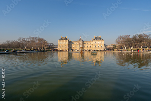 Paris, France - 01 15 2022: The Luxembourg Garden. View of Luxembourg Palace reflecting in the waters of the main basin