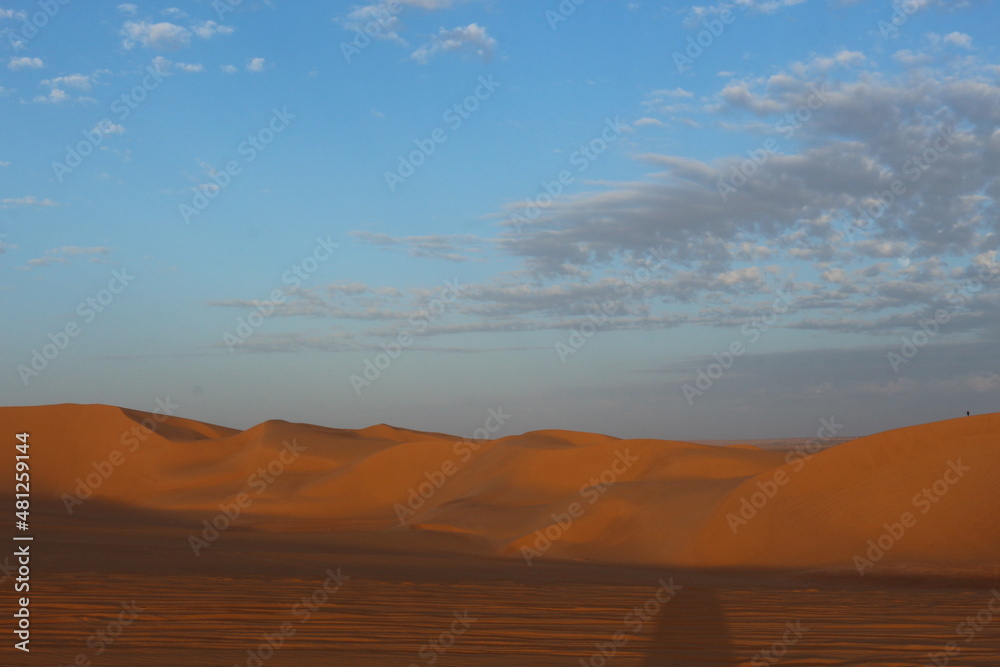 sand dunes in the desert at sunset