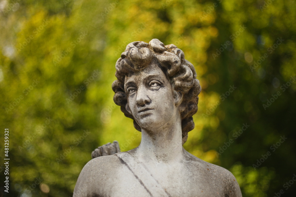 ancient statue of a person in the park