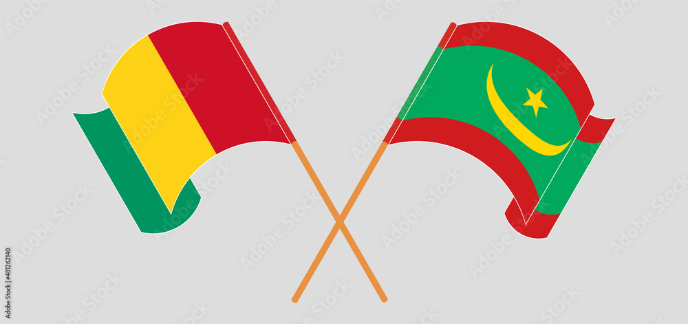 Crossed and waving flags of Guinea and Mauritania Crossed and waving flags of Guinea and Mauritania