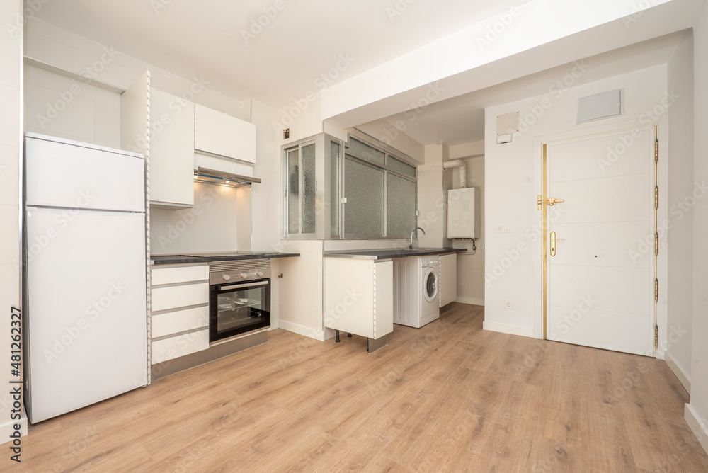 Semi-furnished kitchen in a one-room studio with wooden floors Semi-furnished kitchen in a one-room studio with wooden floors
