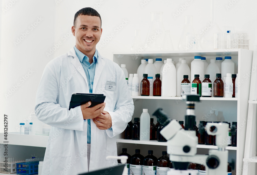 The world will remember his work. Portrait of a confident young scientist working in a modern laboratory. The world will remember his work. Portrait of a confident young scientist working in a modern laboratory.