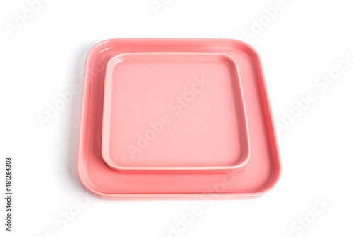Pink plates is isolated on a white background. © jul_photolover