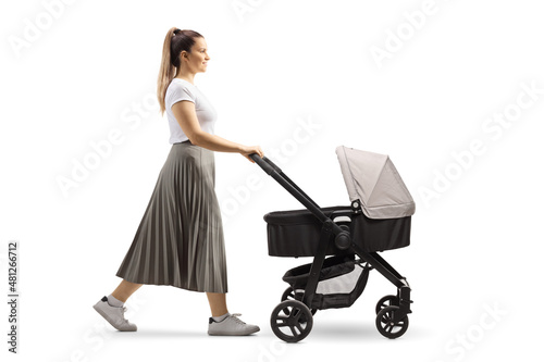 Картината върху платно Full length profile shot of a young mother pushing a baby stroller