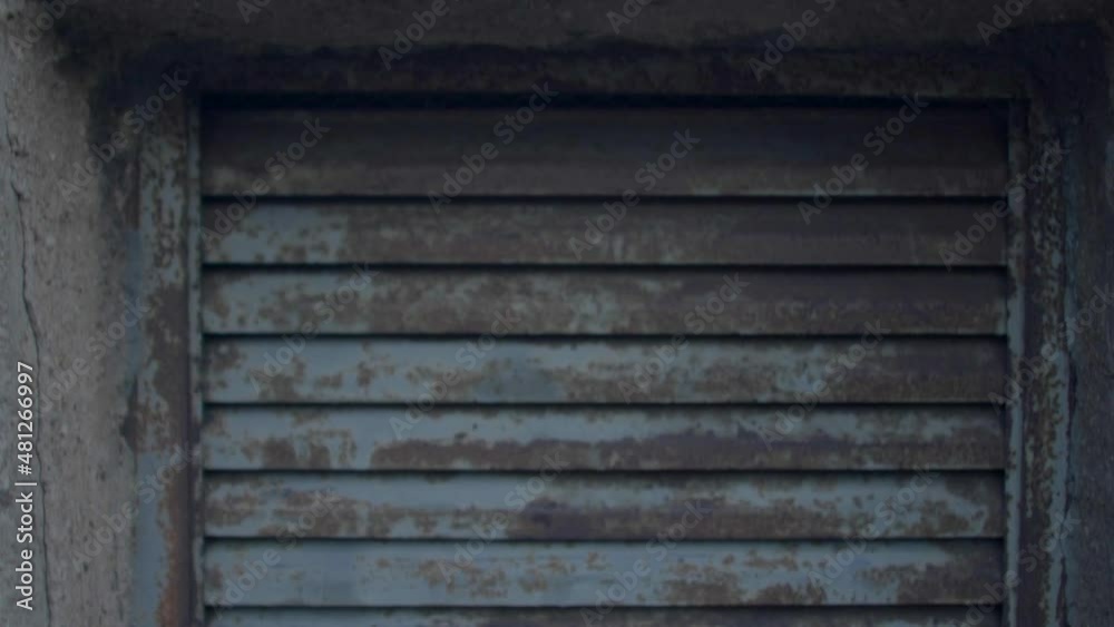 Old rusty ventilation grill in the outer concrete wall of a city building, conditioner blows the air out, smells of the restaurant kitchen. Close up. Old rusty ventilation grill in the outer concrete wall of a city building, conditioner blows the air out, smells of the restaurant kitchen. Close up.