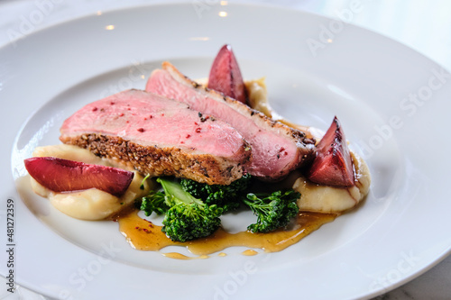 Summer duck with roasted plumb and sherry. photo