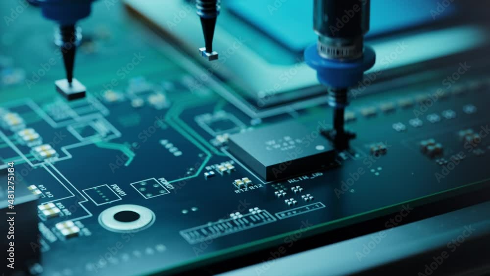 Macro Shot of Automatic Pick and Place machine quickly installs Components on Circuit Board. Electronics and Circuit board Manufacturing Factory. Loopable.