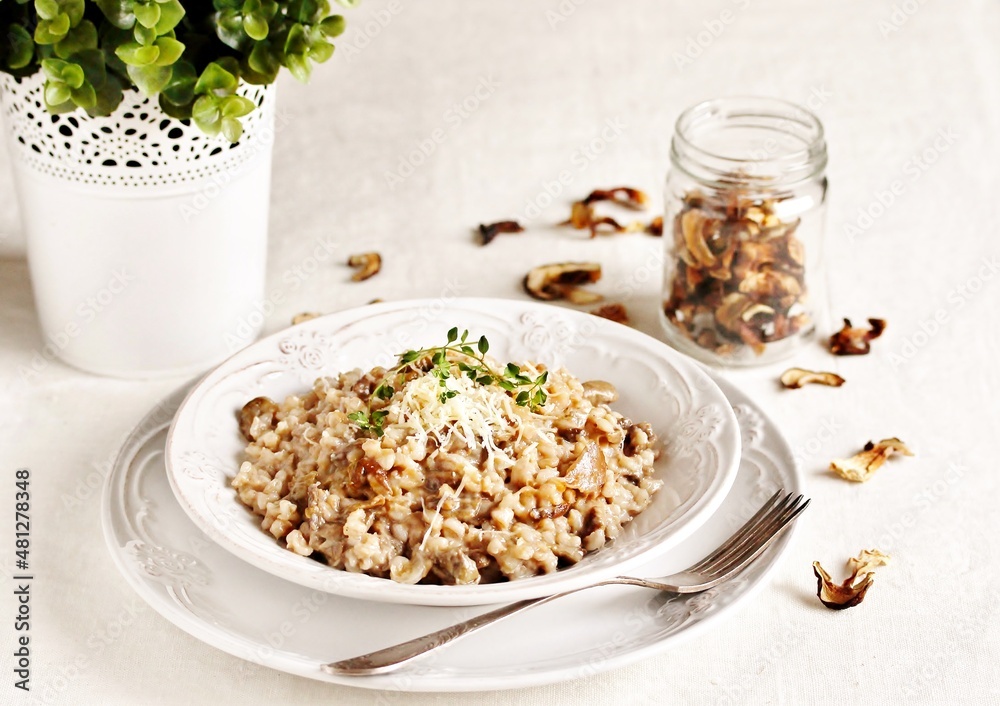 mushroom and barley risotto (Orzotto) - Italian home cooking. barley porridge with mushrooms. mushroom and barley risotto (Orzotto) - Italian home cooking. barley porridge with mushrooms.