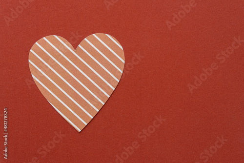 striped paper heart on a fabric background
