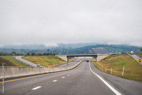 Moorefield, West Virginia Allegheny mountains driving car point of view on road to Dolly Sods with cars in traffic on highway and overcast cloudy mist fog sky weather photo
