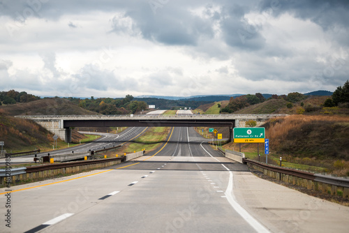 Moorefield, West Virginia Allegheny mountains driving with exit sign car point of view on road to Dolly Sods with cars in traffic on highway and overcast cloudy mist fog sky weather photo