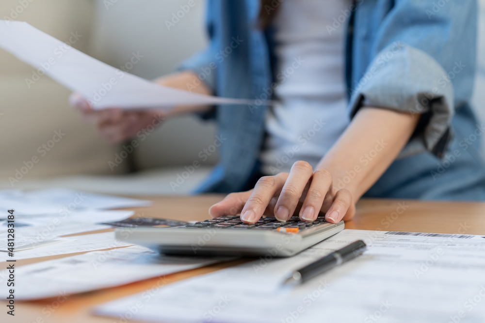 Financial owe asian young woman, girl sitting suffer, stressed and confused by calculate expense from invoice or bill, have no money to pay, mortgage or loan. Debt, bankruptcy or bankruptcy concept.v