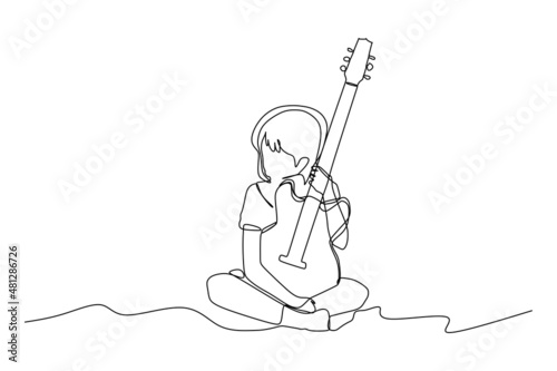 Single continuous line drawing of a child holding a guitar - Modern one line draw design vector illustration