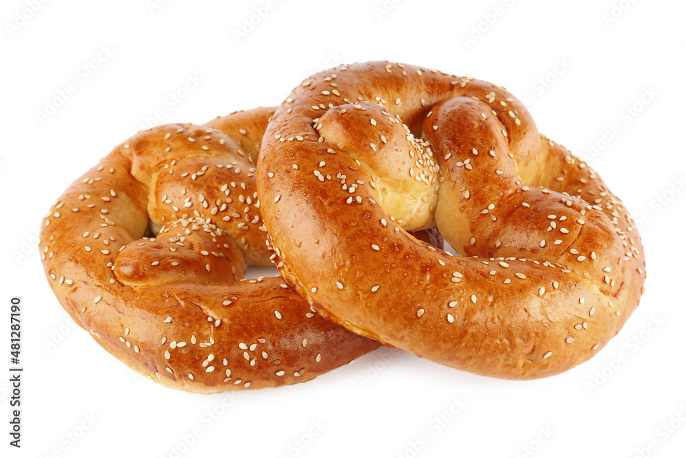 Tasty freshly baked pretzels on white background