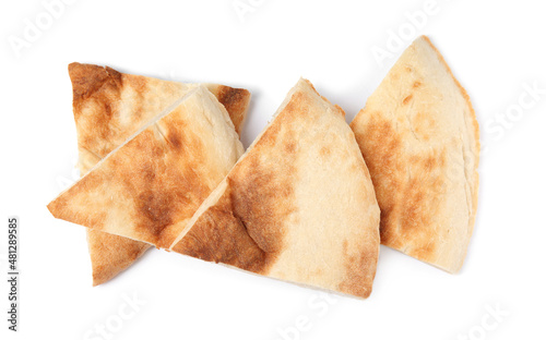 Cut fresh pita bread on white background, top view photo