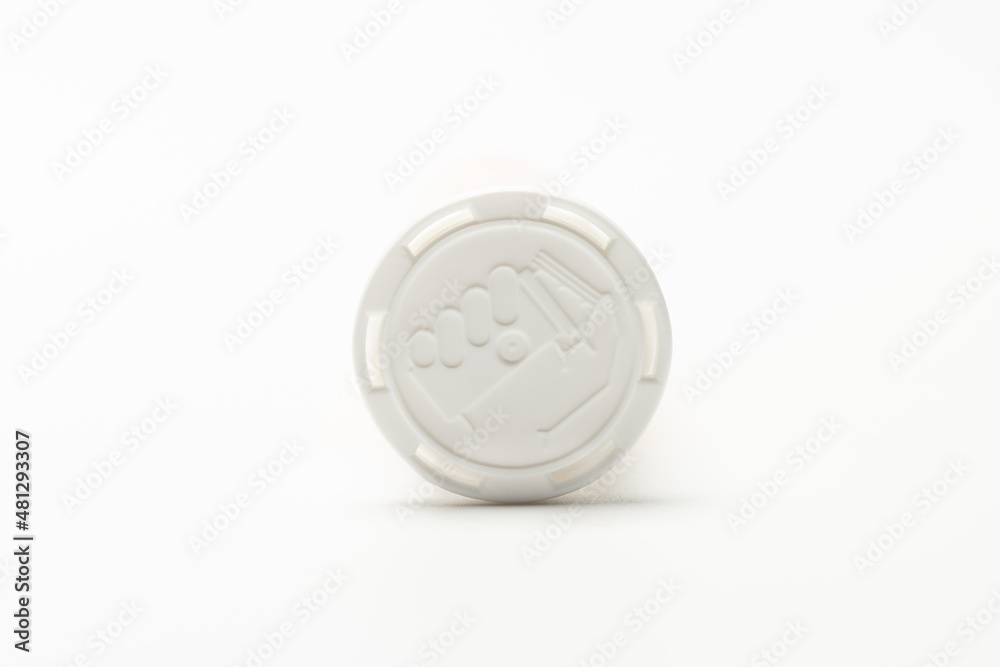 a imprinted Symbol or instruction on how to open bottle cap. isolated on white background. a imprinted Symbol or instruction on how to open bottle cap. isolated on white background.