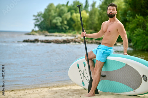 Man with kayak spending time on a beach