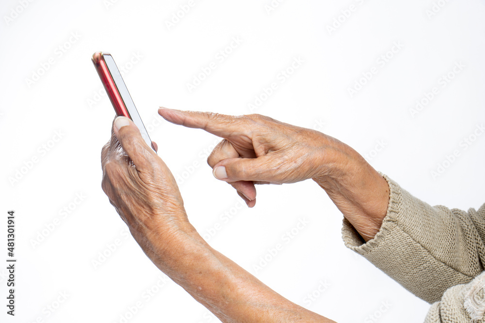Senior adult using a cellphone at home.